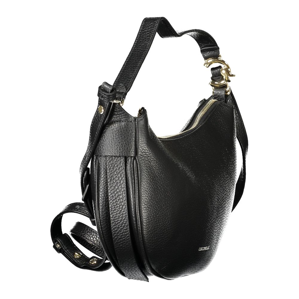 Coccinelle Black Leather Handbag with adjustable strap and zip closure, featuring an internal pocket and logo design.