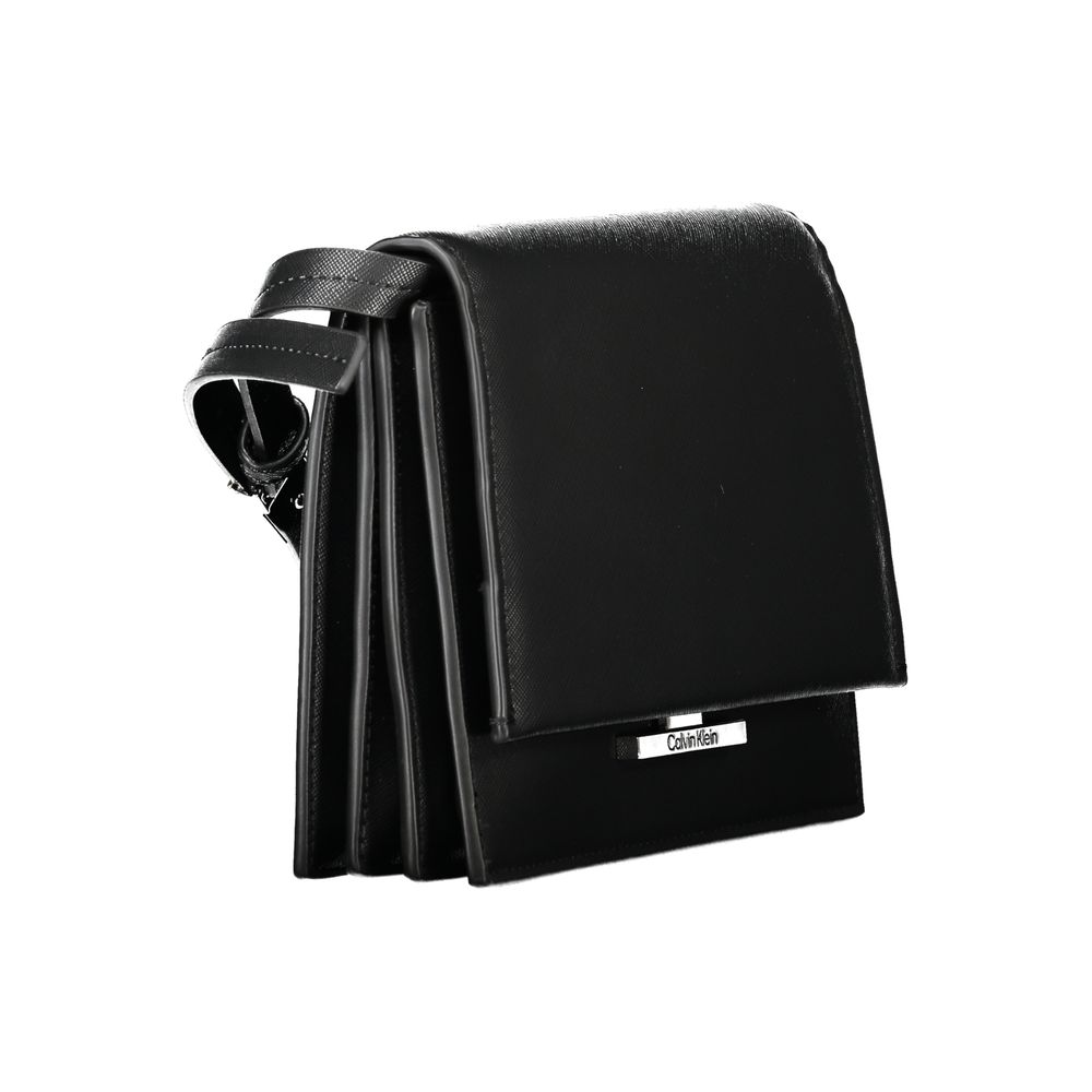 Calvin Klein Black Polyethylene Handbag with adjustable shoulder strap, internal compartments, pocket, and logo on snap closure.