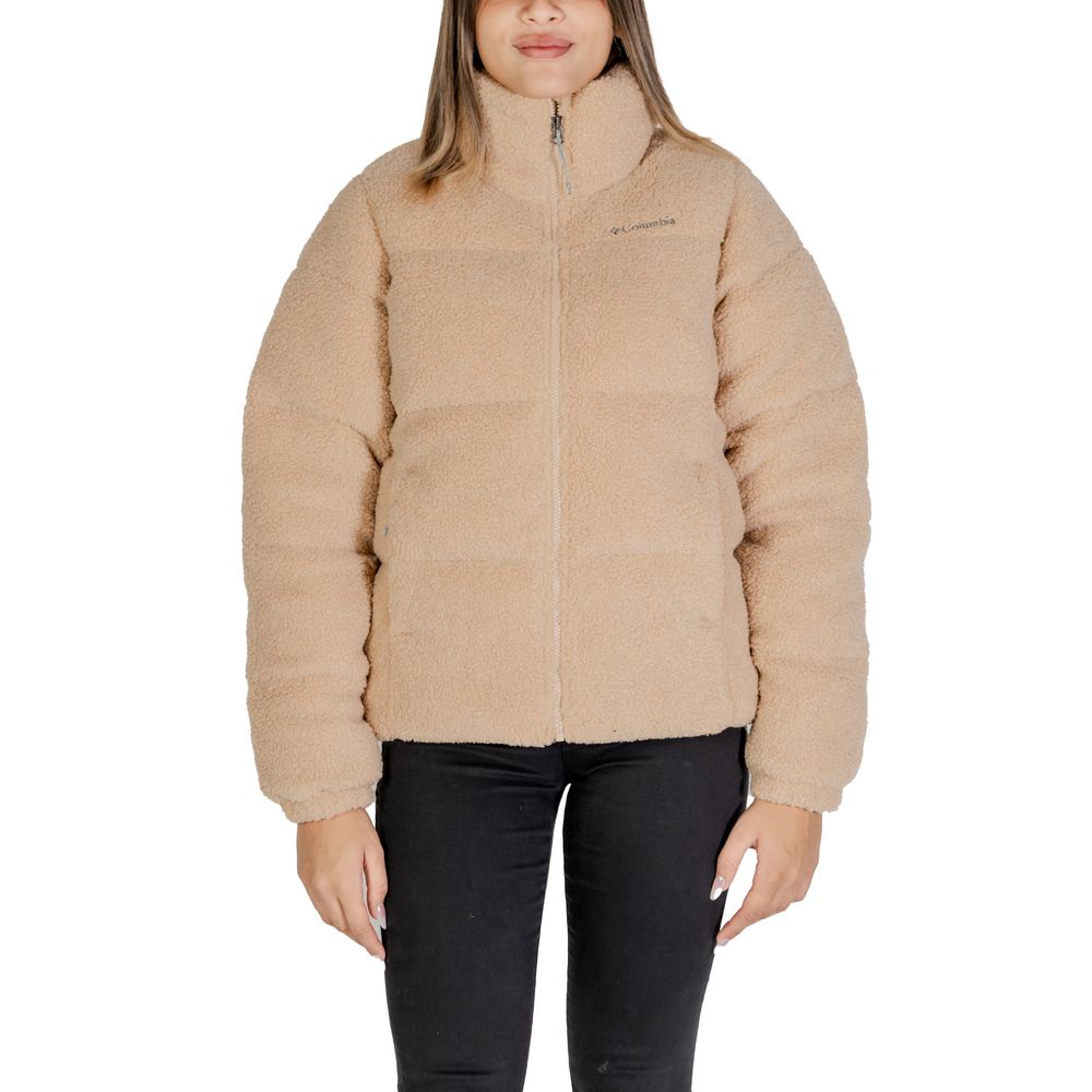 Woman wearing Columbia Beige Nylon Coat with Sherpa lining, ideal for winter fashion and outdoor activities; features front zip closure.