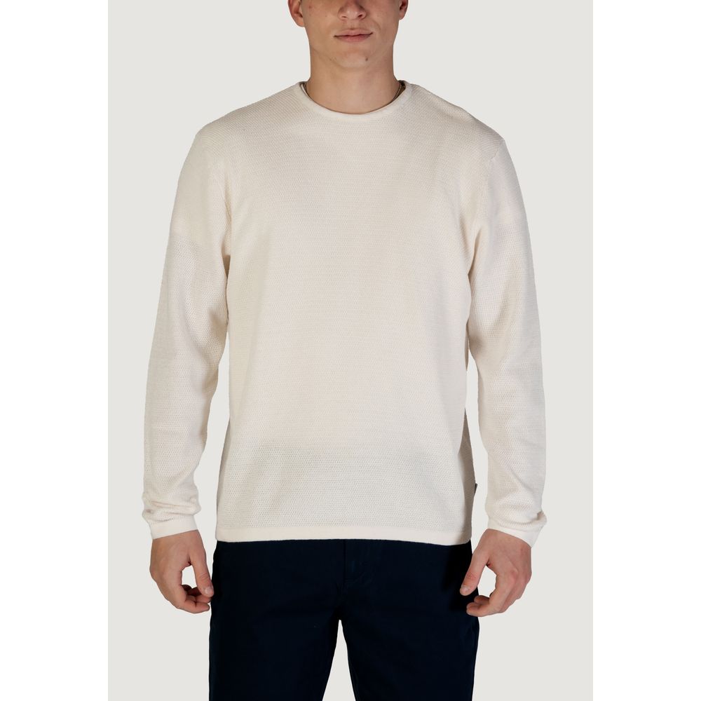 Man wearing Jack Jones White Cotton Sweatshirt with crew neck and fine knit texture, crafted from a cotton and recycled materials blend.