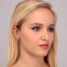 Model wearing LA PETITE STORY JEWELRY Mod. LPS02ARQ182 earrings with a side profile view.