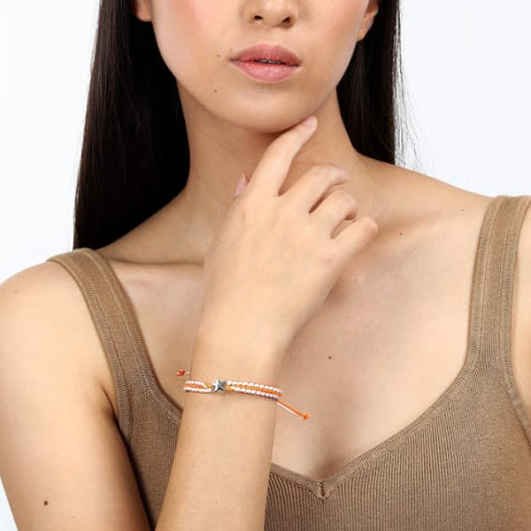 Woman wearing LA PETITE STORY JEWELRY Mod. LPS05ARR79 bracelet with a thoughtful pose.