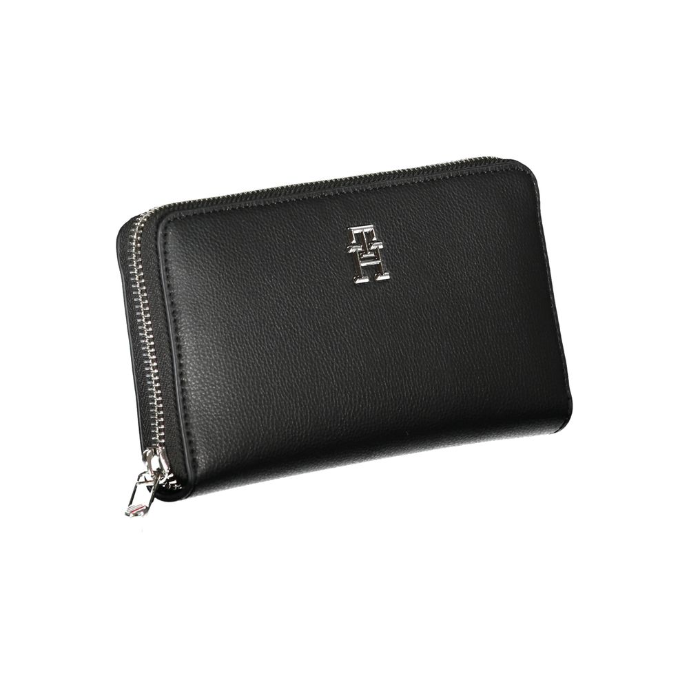 Tommy Hilfiger Black Polyester Wallet with zip closure, featuring logo and multiple card slots, made from recycled materials.