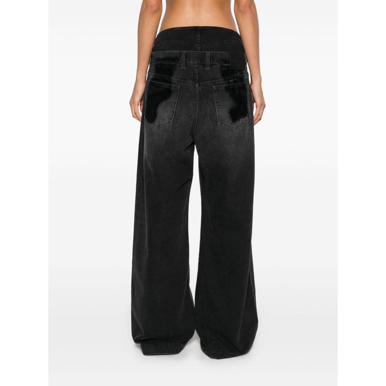 بنطلون جينز أتيكو المصنوع من قماش الدنيم القطني الأسود والممزق