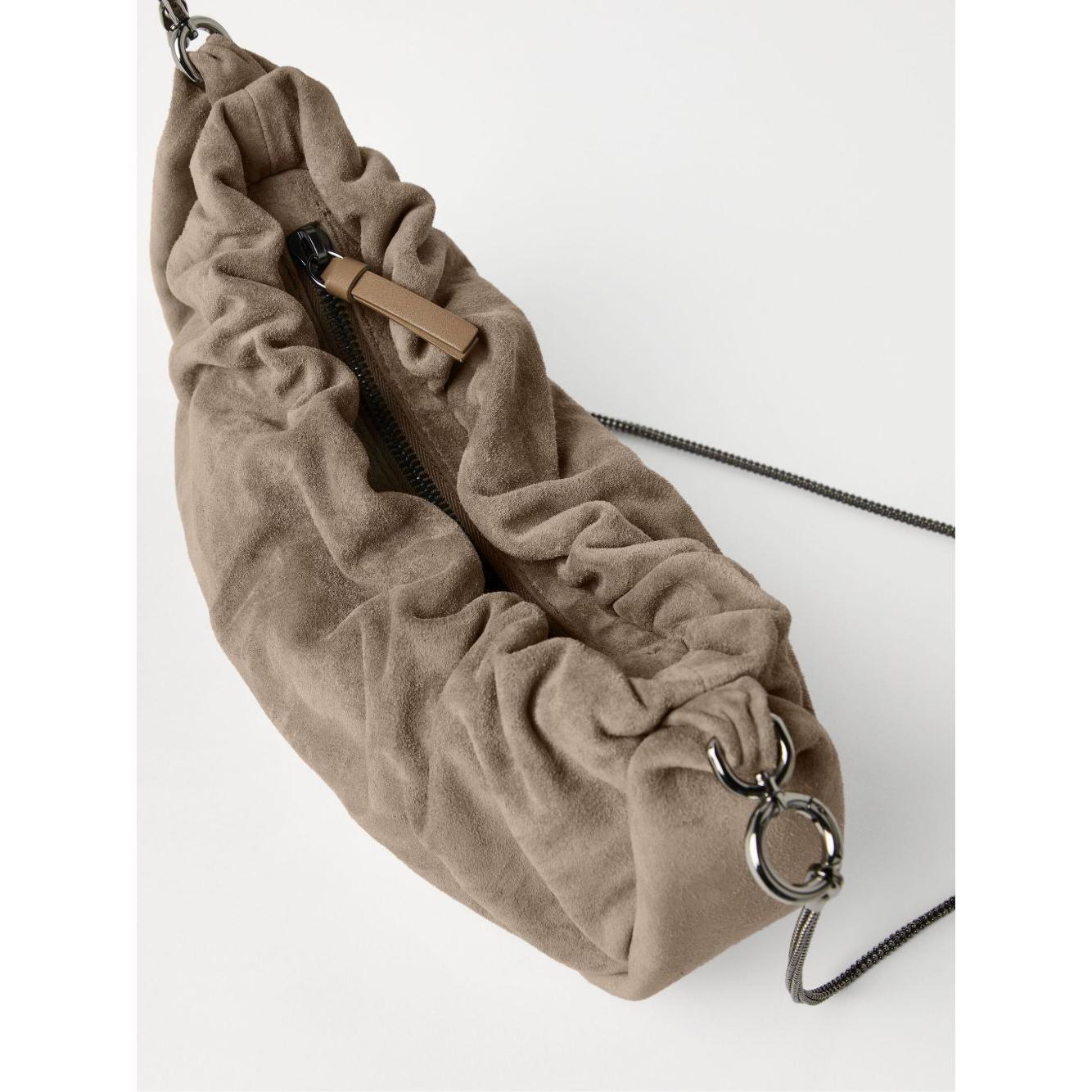 Front view with bag zipped and handles upright.
