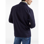 Back view of Brunello Cucinelli Shirts Blue with button fastening and chest flap pockets, showcasing long sleeves and buttoned cuffs in wool.