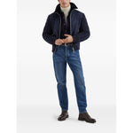 Man wearing Brunello Cucinelli Shirts Blue with jeans and jacket, full body view