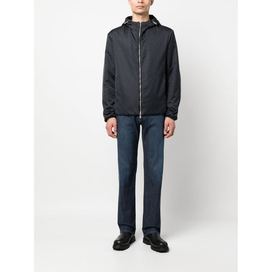Emporio Armani Coats Blue, navy blue nylon blouson jacket with monogram jacquard, silver-tone hardware, drawstring hood, and zip fastening.