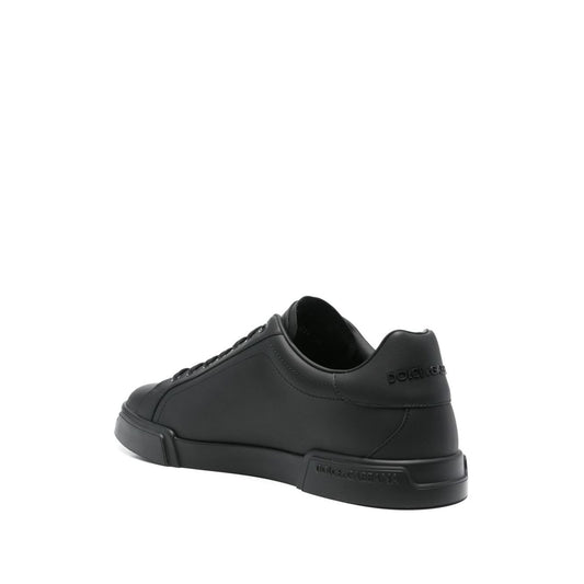 Dolce & Gabbana Sneakers Black with round toe and flat rubber sole, rear view of Portofino leather design.