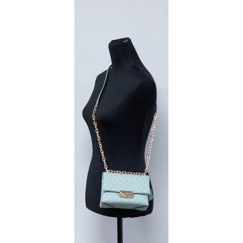 حقيبة كروس بودي صغيرة قابلة للتحويل من مادة PVC باللون الأخضر البحري من Michael Kors Cece