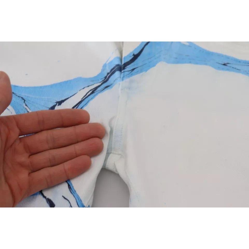 بنطلون جينز ضيق من القطن باللون الأبيض والأزرق من دولتشي آند غابانا