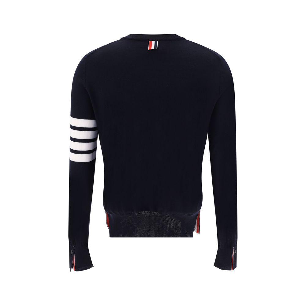Back view of Thom Browne Gray Fleece Wool Sweatshirt featuring ribbed hem and iconic horizontal stripes on left arm.