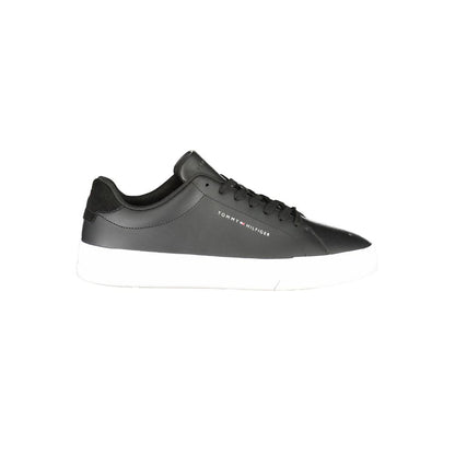 Tommy Hilfiger Black Leather Men Sneaker with contrasting white sole, featuring iconic logo, designed for modern style and comfort.