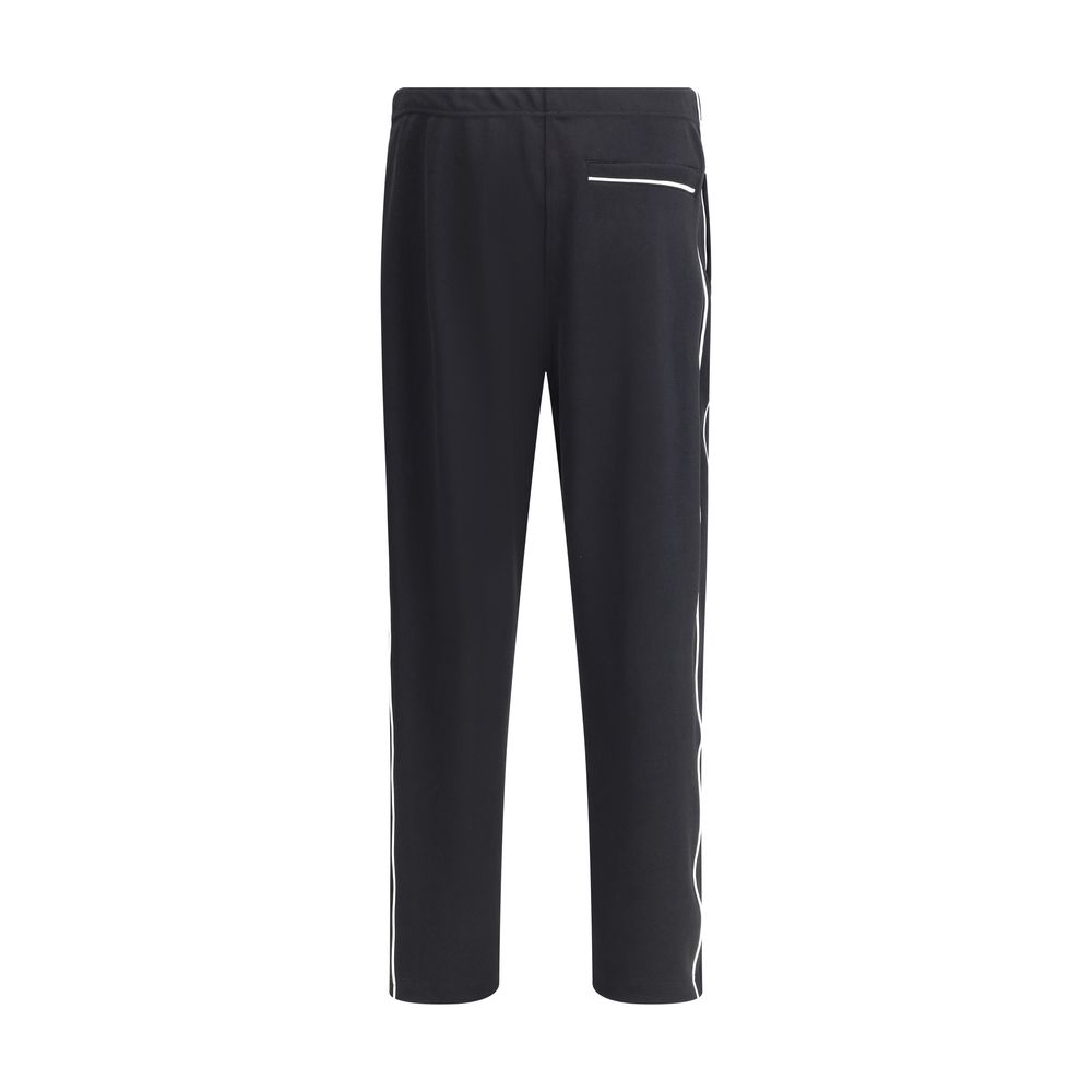 Kenzo Black Polyester Joggers with logo and zipper welt pocket, featuring adjustable waistband and side slash pockets.