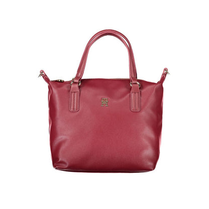 Tommy Hilfiger Red Polyester Handbag with two handles, adjustable strap, internal pocket, zip closure, and logo imprint.