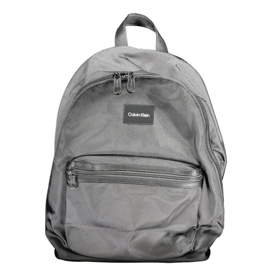 Calvin Klein Black Polyester Backpack with adjustable straps, laptop holder, and water repellent fabric. Ideal for travel and daily use.