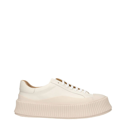 Jil Sander Beige Leather Platform Sneakers with aged effect, lace-up closure, rubber sole, and 5 cm wedge heel, round toe design.