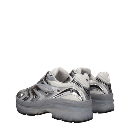 Valentino Garavani Gray Fabric Athletic Sneakers with studs and rubber sole, featuring mid heels and lace-up closure.