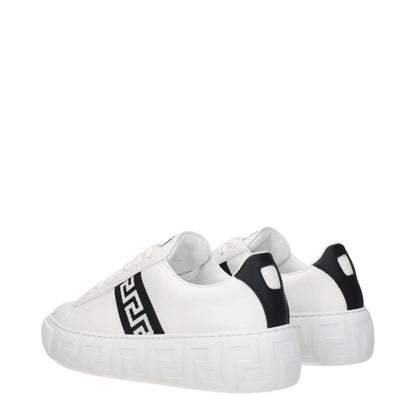 Versace White Leather Low Top Sneakers with black accents, featuring a front logo, lace-up closure, round toe, and rubber sole, side view.