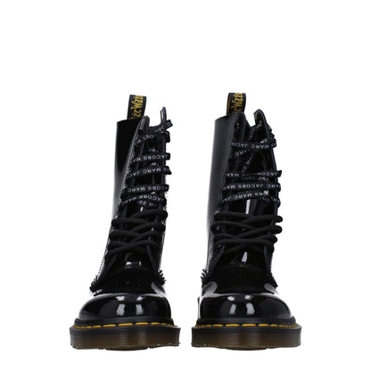Dr. Martens Black Leather Ankle Boots with patent leather, lace-up closure, rubber sole, round toe, and low heel.