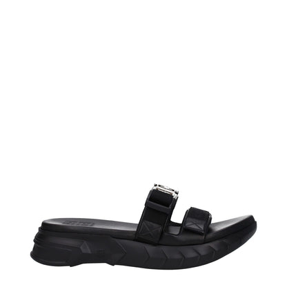 Givenchy Black Fabric Slippers with silver logo, mid heels, rubber sole, open toe, and clip closure.