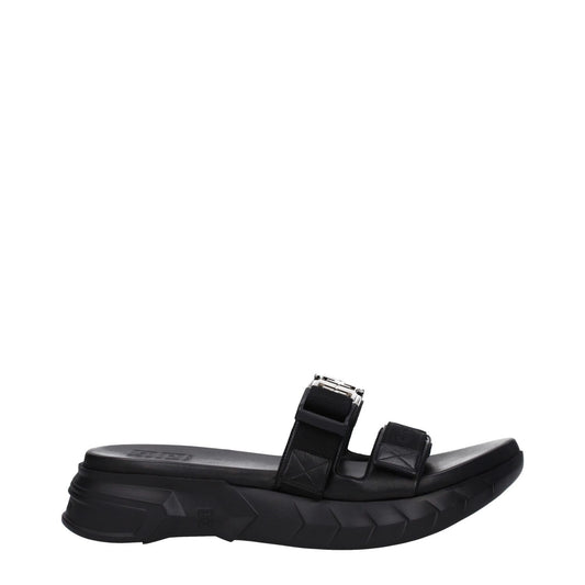 Givenchy Black Fabric Slippers with silver logo, rubber sole, mid heels, open toe, and clips closure. MPN BH301QH1A2001.