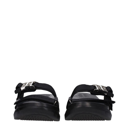 Givenchy Black Fabric Slippers with silver clip closure, rubber sole, open toe, mid heels, featuring front logo design.