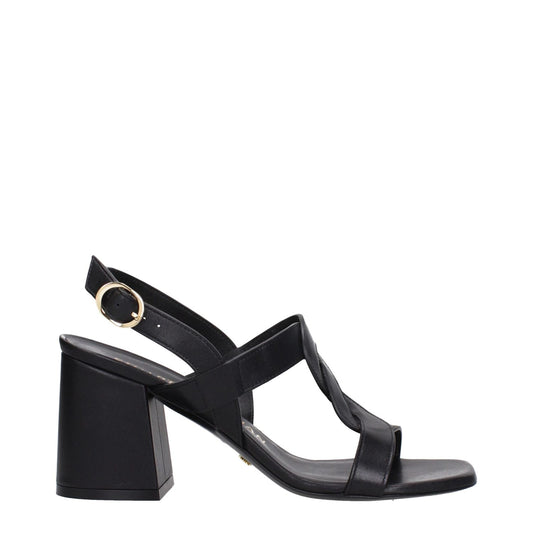 Stuart Weitzman Black Leather Platform Sandals with mid heel and open toe, featuring a buckle closure and leather sole.