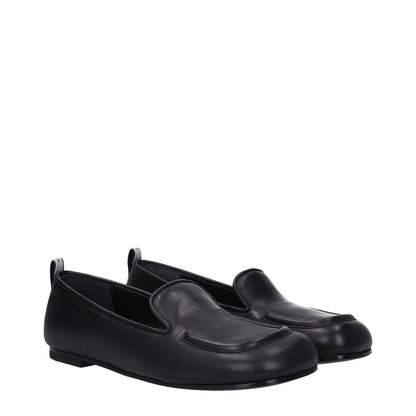 Premiata Black Leather Slip-On Loafers with round toe and back logo, featuring low flat heel and leather sole.
