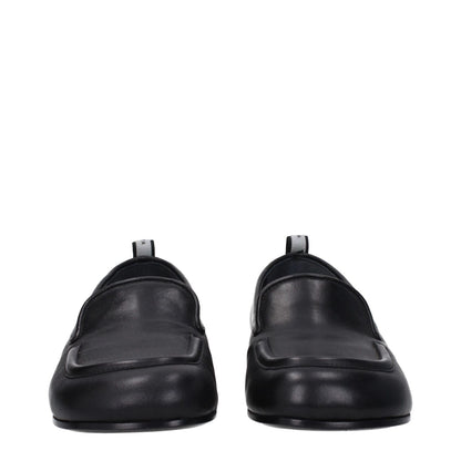 Premiata Black Leather Slip-On Loafers with low flat heel and round toe, featuring a back logo on leather sole. MPN PELLEM6705NERO.