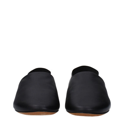 Front view of Givenchy Black Leather Slides with low flat heel, featuring round toe and side logo design.