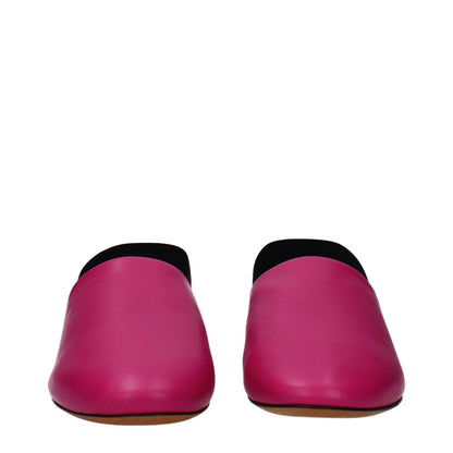 Givenchy Pink Leather Flat Sandals with side and back logo, low flat heel, and round toe design in fuchsia leather.