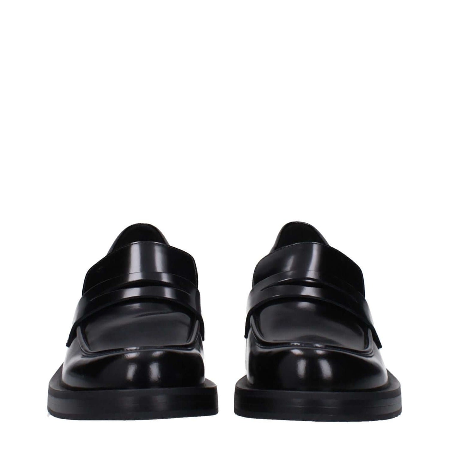 Front view of Stuart Weitzman Black Leather Slip-On Loafers with mid heels and round toe design.