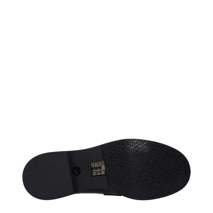 Sole view of Stuart Weitzman Black Leather Slip-On Loafers with textured rubber sole design.