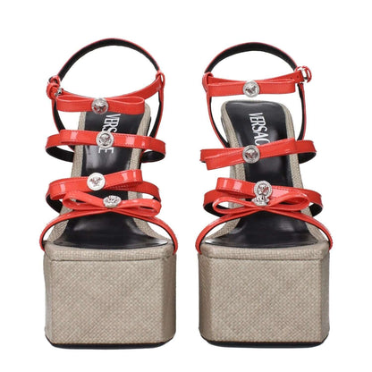 Versace Orange Leather Platform Sandals with patent leather and front logo design, showcasing stylish high platform and straps.
