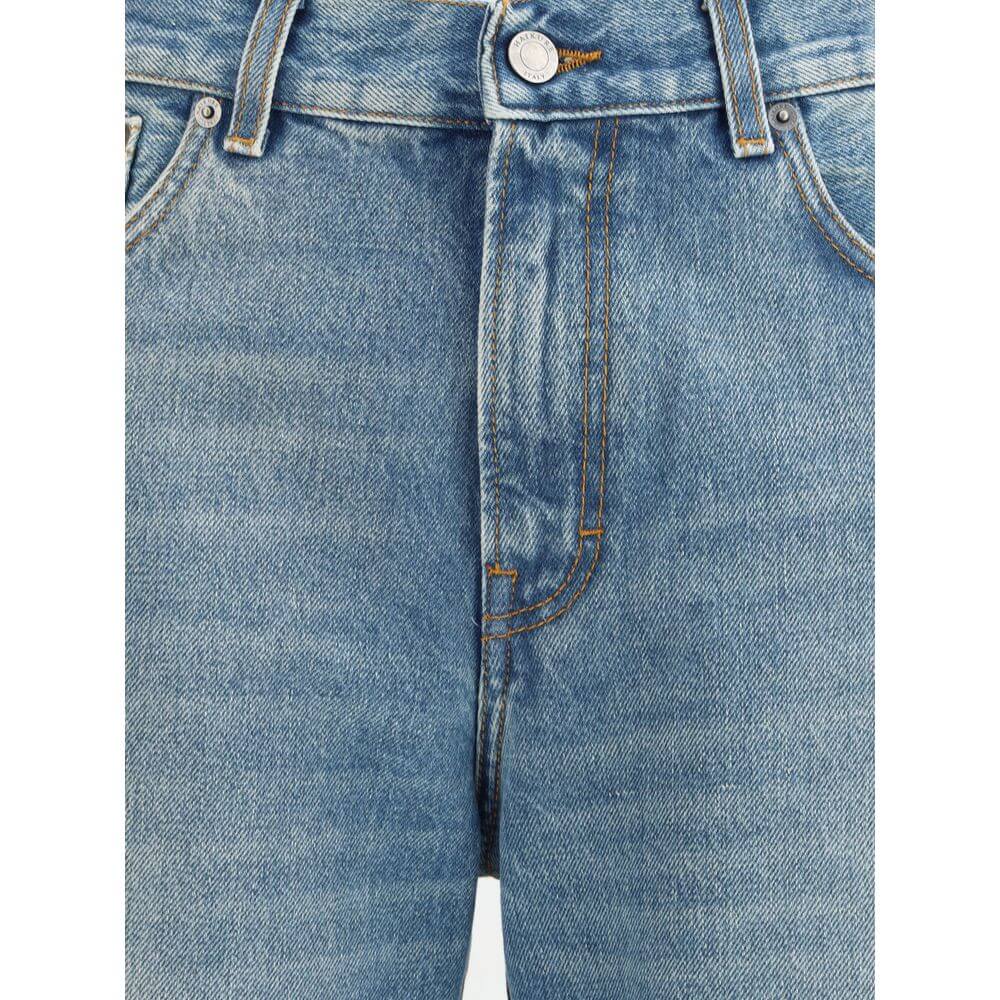 Close-up of Haikure Light Blue Cotton Flared Jeans with button closure and stitching detail.