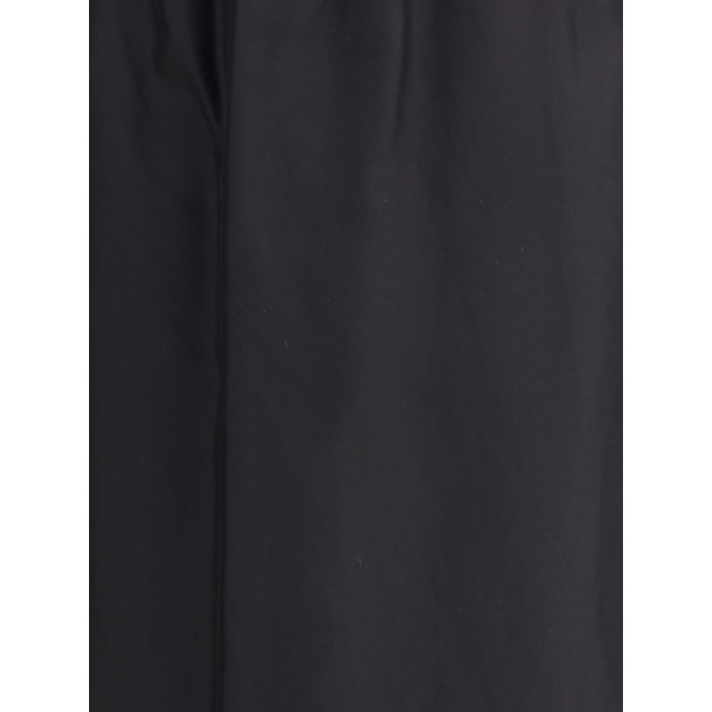Close-up of The Row Black Cotton Midi Skirt, showcasing minimalist style and cotton-silk voile fabric in black with a slightly flared fit.