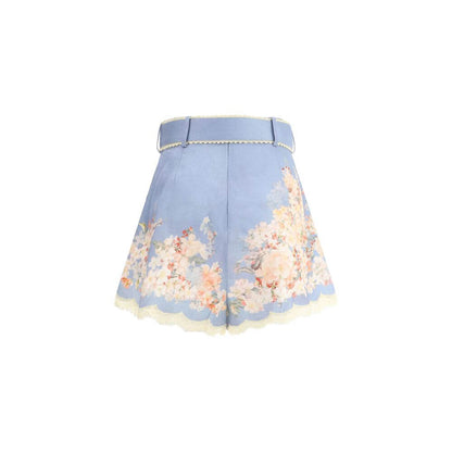Zimmermann Light Blue Linen Bermuda Shorts with floral print, belted waist, and soft pleats, perfect for a chic summer look.