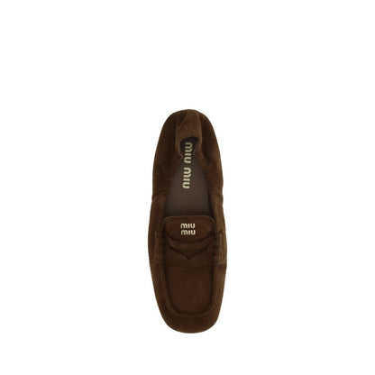 Top view of Miu Miu Brown Calf Leather Bos Taurus Slip-On Loafers with suede leather and horsebit detail.