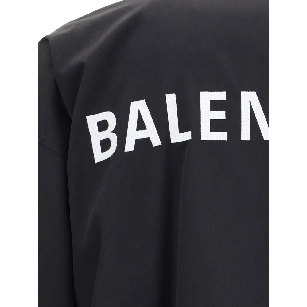 Close-up of Balenciaga Black Polyester Shell Jacket featuring white embroidered logo.