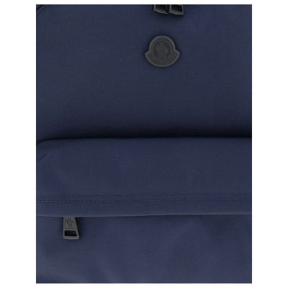 Moncler Blue Nylon Backpack showcasing water-repellent fabric with zipper closure and elegant leather trim.