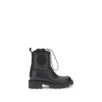 Moncler Black Rubber Lace-Up Boots with logo applique and drawstring closure, featuring a durable rubber sole, perfect for all conditions.