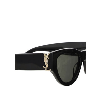 Saint Laurent Black Acetate Sunglasses with gold logo, elegant cat-eye shape with vintage and contemporary style, feminine and bold design.