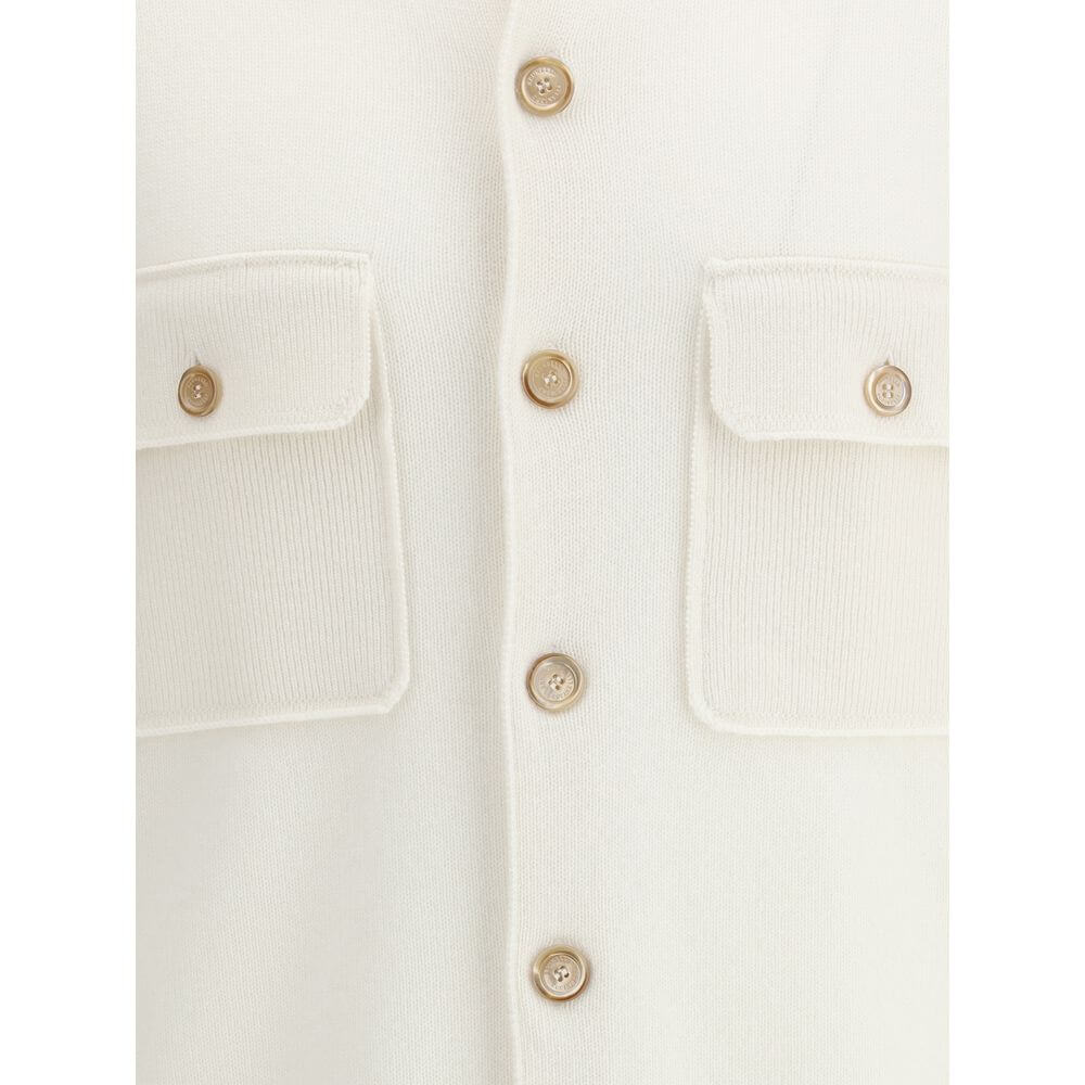 Close-up of Brunello Cucinelli White Cashmere Cardigan with ribbed collar, button closure, and patch pockets. Made in Italy.
