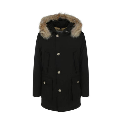 Woolrich Black Cotton Parka with fur hood, front pockets, and invisible zip closure, ideal for AW25 season, made in Bulgaria.