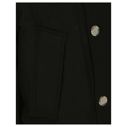 Close-up of Woolrich Black Cotton Parka showing side patch pocket and button details with ribbed cuffs, fur hood, and padded design.