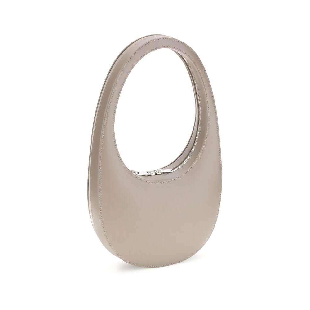Coperni Beige Leather Shoulder Bag with unique hobo silhouette and top two-way zip closure, featuring adjustable shoulder strap.