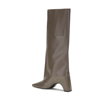 Side view of Coperni Gray Calf Leather Bos Taurus Boots with block heel and square toe design, showcasing structured silhouette and arched sole.