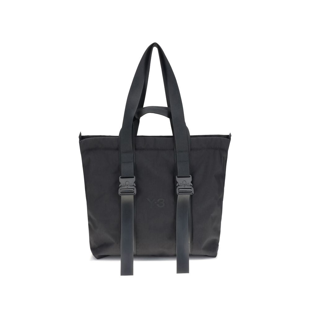 Y-3 Black Nylon Shoulder Bag with zippered closure, top handles, and tone-on-tone logo for stylish practicality.