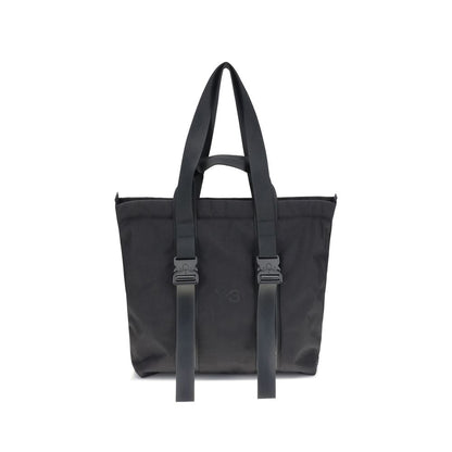 Y-3 Black Nylon Shoulder Bag with zippered closure, top handles, and tone-on-tone logo for stylish practicality.